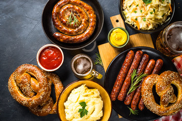 Oktoberfest food - sausage, beer and bretzel.