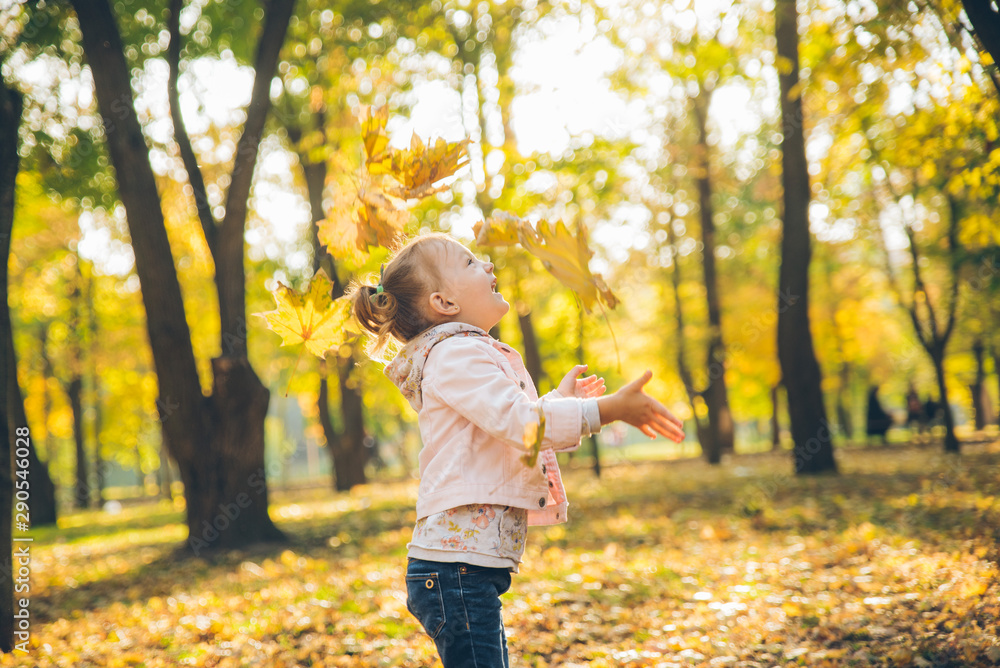 mather with little toddle daughter playing in autumn city public park mather with little toddle daughter playing in autumn city public park