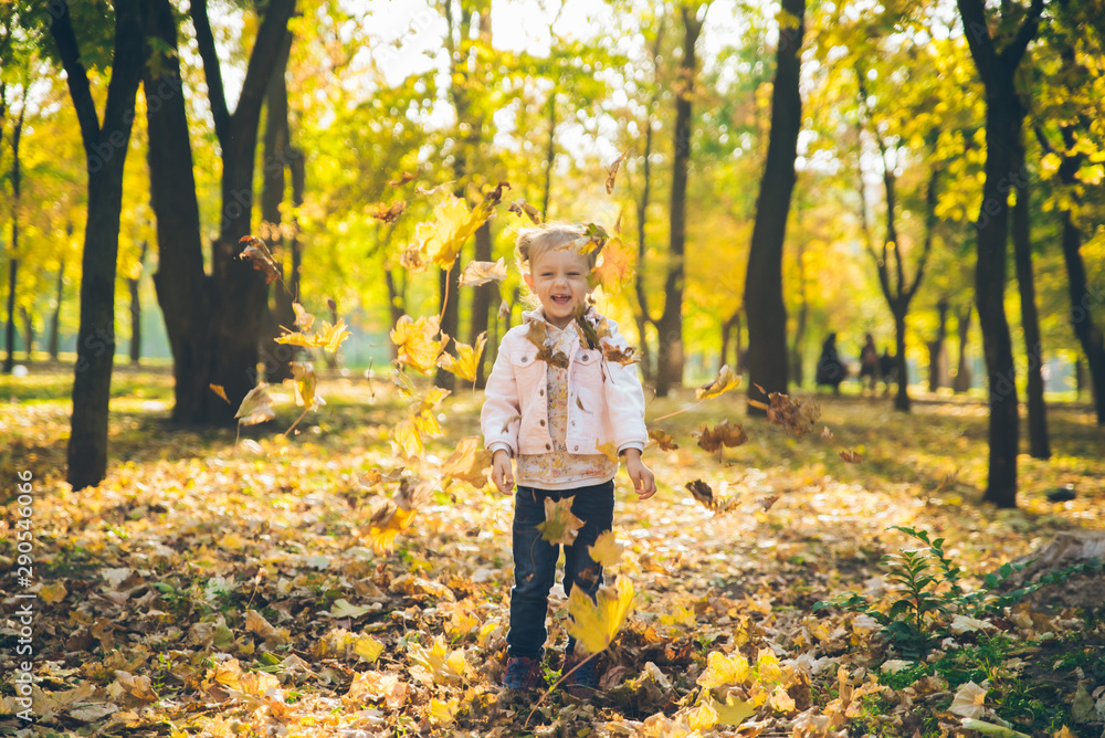 mather with little toddle daughter playing in autumn city public park mather with little toddle daughter playing in autumn city public park