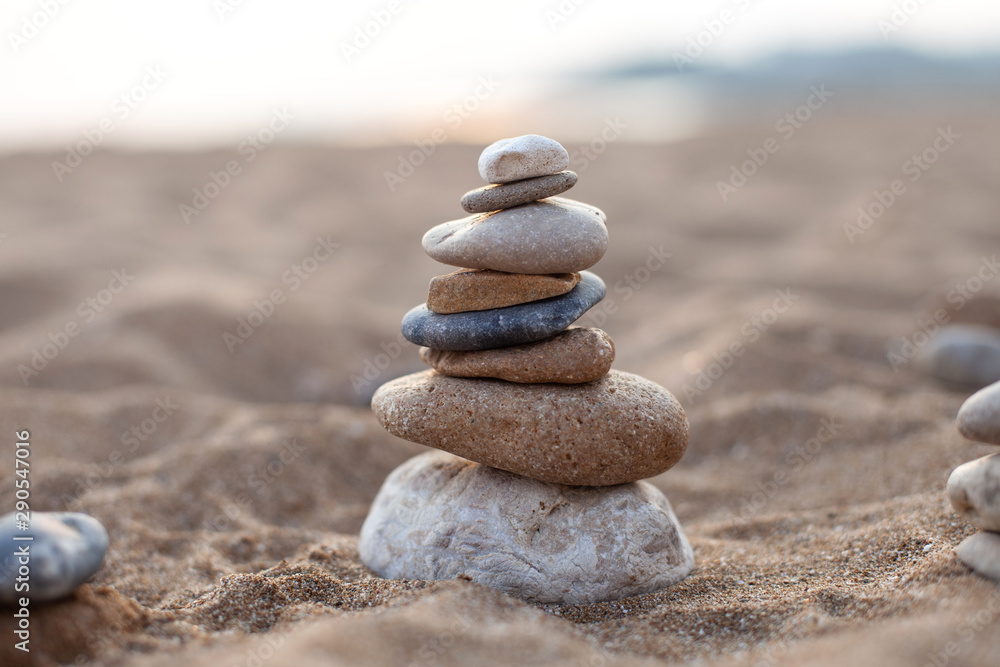 stone sculpture on the beach, beautiful pebble tower stone sculpture on the beach, beautiful pebble tower