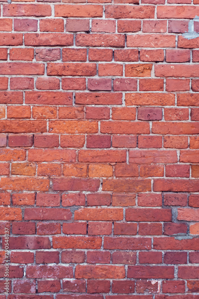 Red bricks background. A part of wall of the building Red bricks background. A part of wall of the building