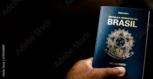 New Passport of the Federative Republic of Brazil - Mercosur Passport on Black Background - Important Document for Foreign Travel. photo