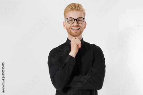 Happy Stylish guy in black shirt and glasses. Folded arms, copy space. Successful young, Entrepreneur concept. Redheaded man with red beard. Start up, young founder concept isolate on white background photo