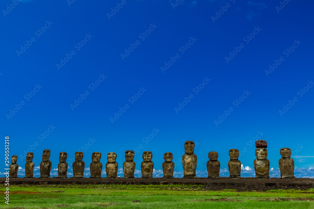 Moai statues of Ahu Tongariki under clear blue sky on Easter Island