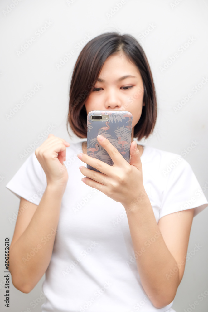 Business asian white shirt women using text on smartphone Business asian white shirt women using text on smartphone