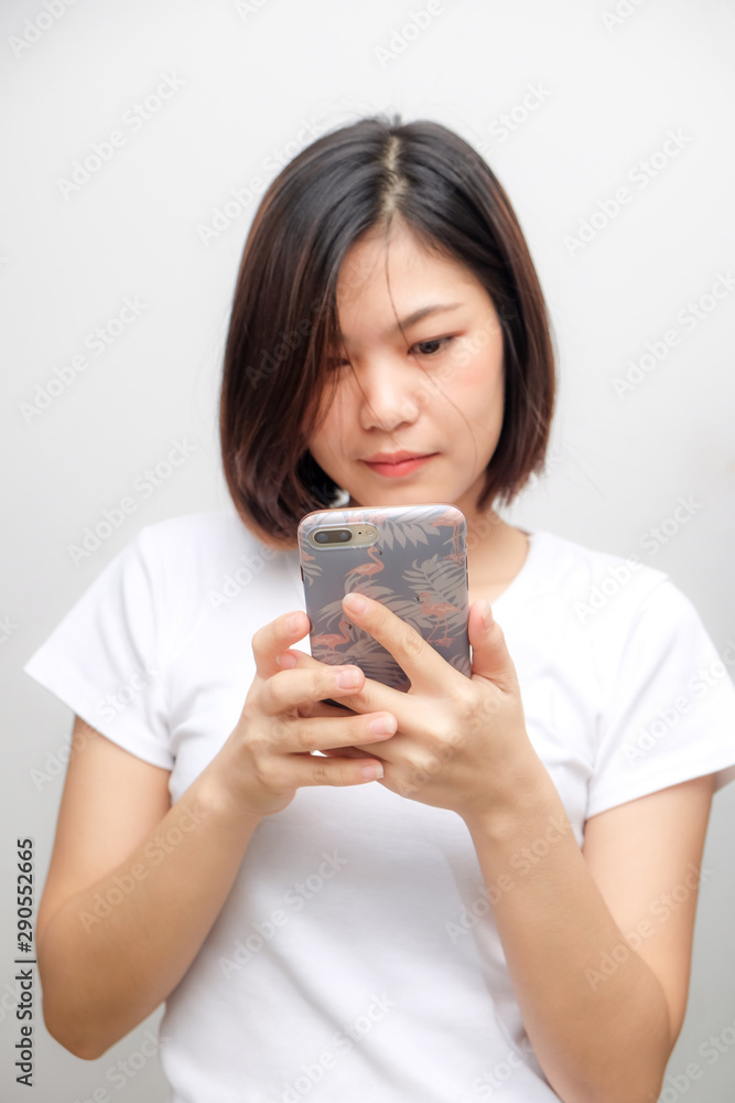 Business asian white shirt women using text on smartphone Business asian white shirt women using text on smartphone
