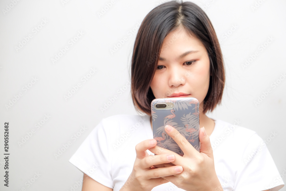 Business asian white shirt women using text on smartphone Business asian white shirt women using text on smartphone