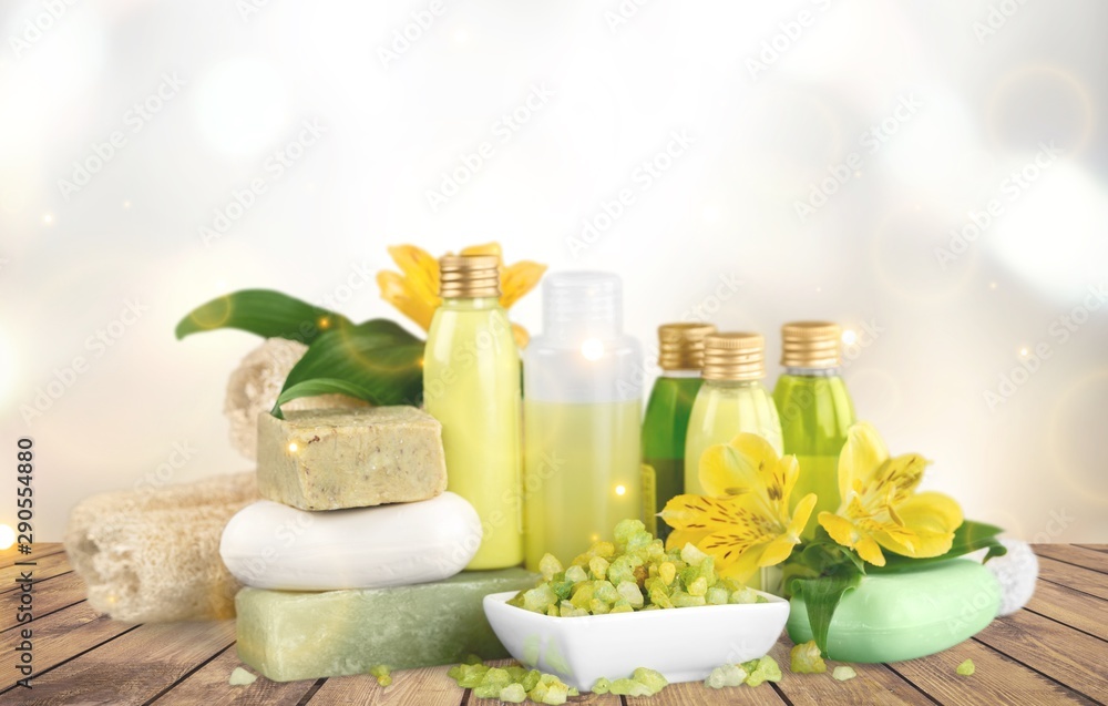 Bottles with organic essential aroma oils on background Bottles with organic essential aroma oils on background