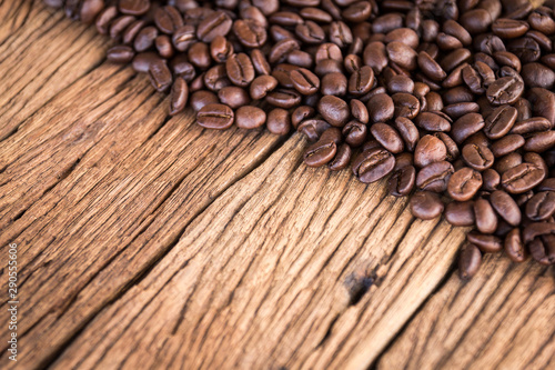 roasted coffee beans on old wooden background