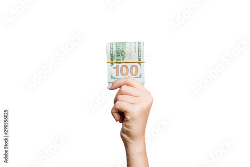 Isolated image of female hand holding a bundle of dollars on white background. Payment concept