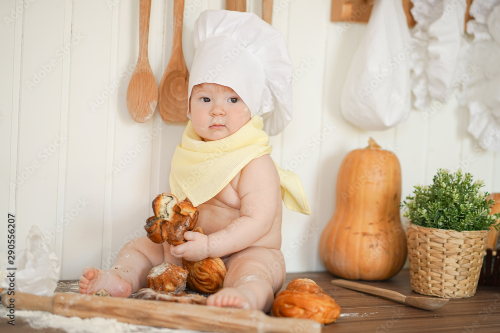 little baker child in chef hat at kitchen table alone little baker child in chef hat at kitchen table alone