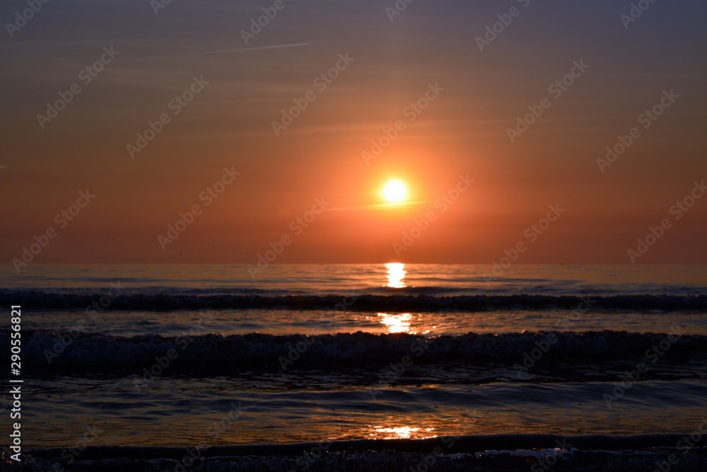 a sunrise at the seashore