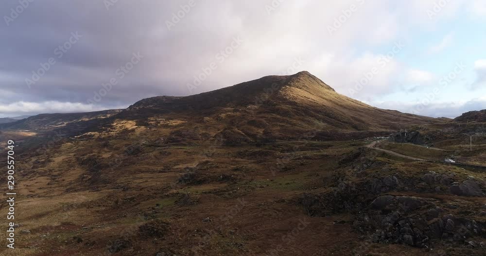 Road leads up mountains in Killarney National Park, aerial Road leads up mountains in Killarney National Park, aerial