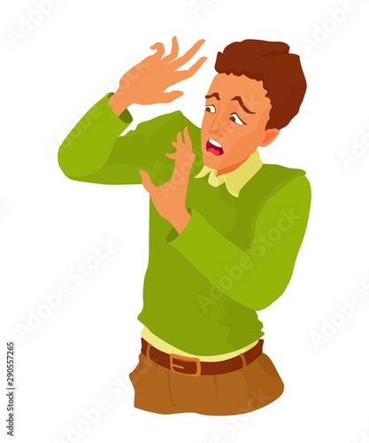 The young man is frightened, covers himself with his palms from danger. Boy with a look of a scare on his face.