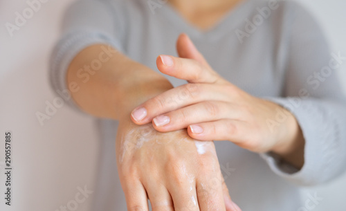 Applying hand cream movement.