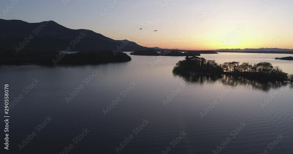 Wide aerial, sunset over calm lake in Killarney National Park Wide aerial, sunset over calm lake in Killarney National Park