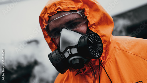 Protection respirator half mask for toxic gas.The man prepare to wear protection air pollution in the chemical industry photo