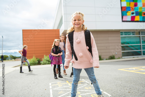 A Hopscotch on the schoolyard with friends play together photo