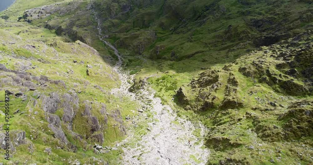 Descending down mountainside in MacGlllycuddy's Reek, high angle aerial Descending down mountainside in MacGlllycuddy's Reek, high angle aerial