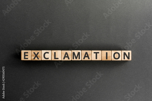 exclamation - word from wooden blocks with letters, express surprise or shock exclamation concept, top view on grey background