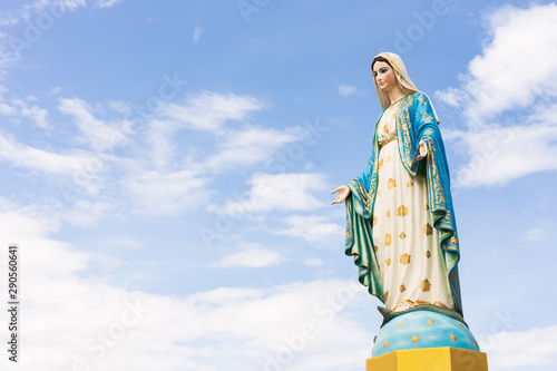 The Blessed Virgin Mary,mother of Jesus on the blue sky, in front of the Roman Catholic Diocese, public place in Chanthaburi, Thailand.