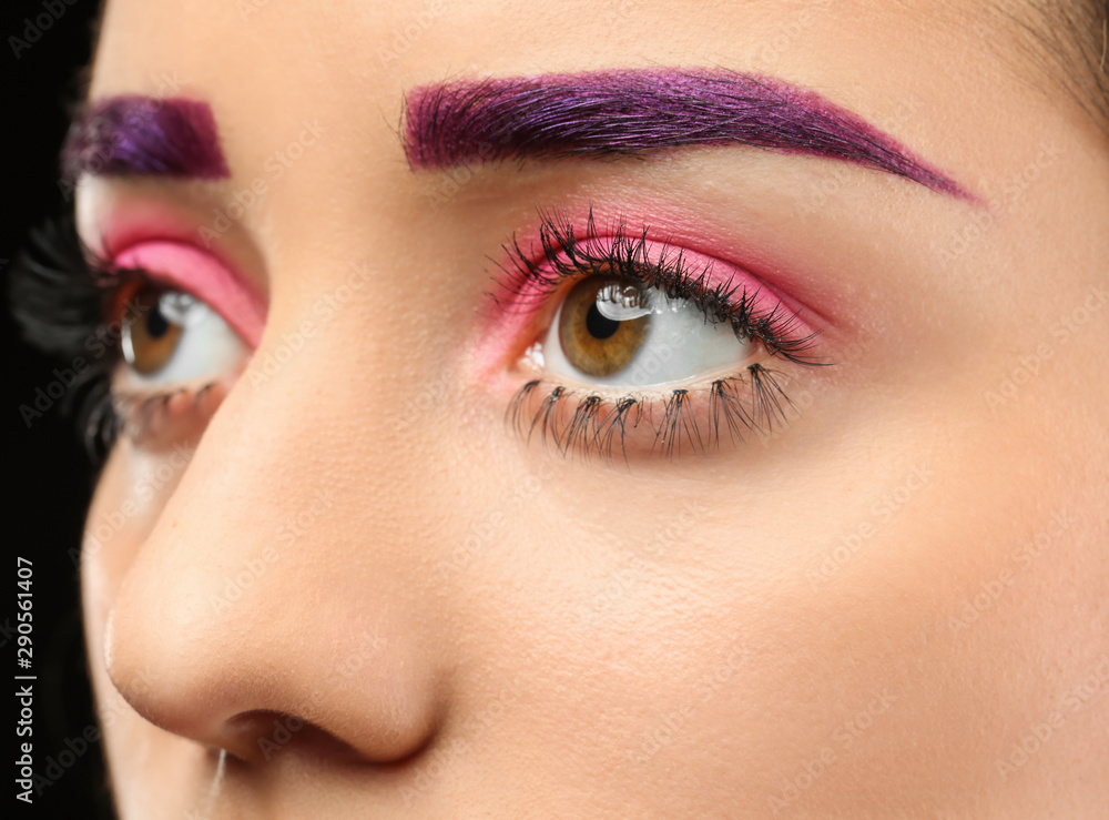 Young woman with dyed eyebrows and creative makeup, closeup