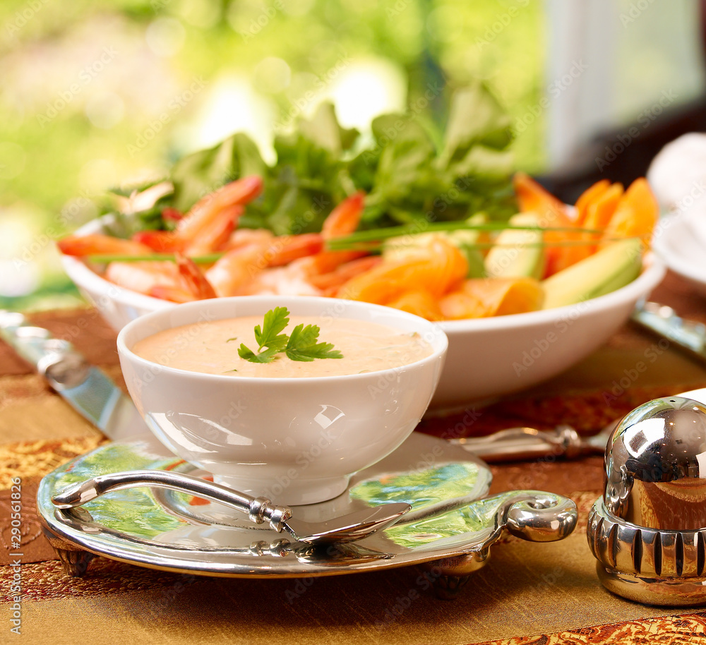 Spicy Tomato Dip in bowl in table setting Spicy Tomato Dip in bowl in table setting