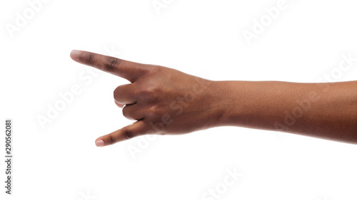 Black woman's hand making goat sign isolated on white background
