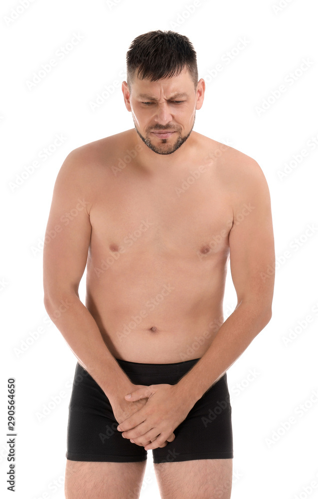 Man suffering from pain on white background. Urology problems Man suffering from pain on white background. Urology problems