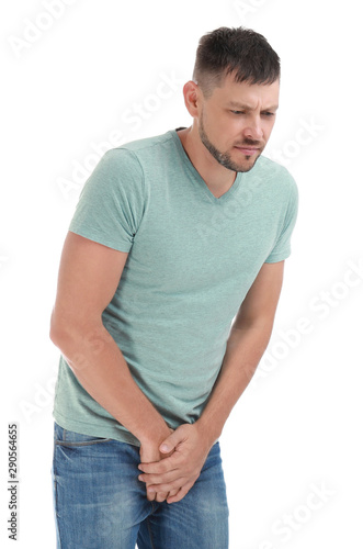 Man suffering from pain on white background. Urology problems