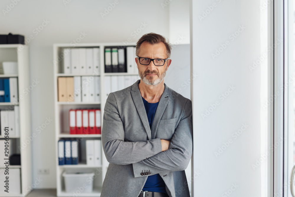 Worried businessman staring intently at the camera Worried businessman staring intently at the camera