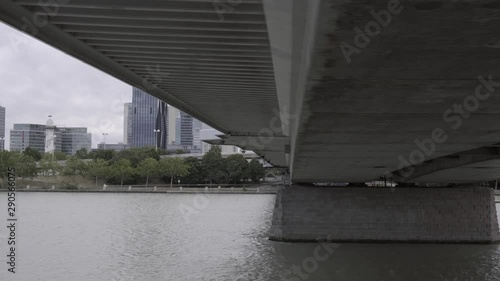 Sailing under the Reichsbrucke. High-rise buildings in the outer district. in Donaustadt. Vienna photo