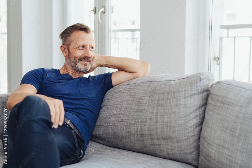 Attractive fit middle-aged man relaxing at home Attractive fit middle-aged man relaxing at home