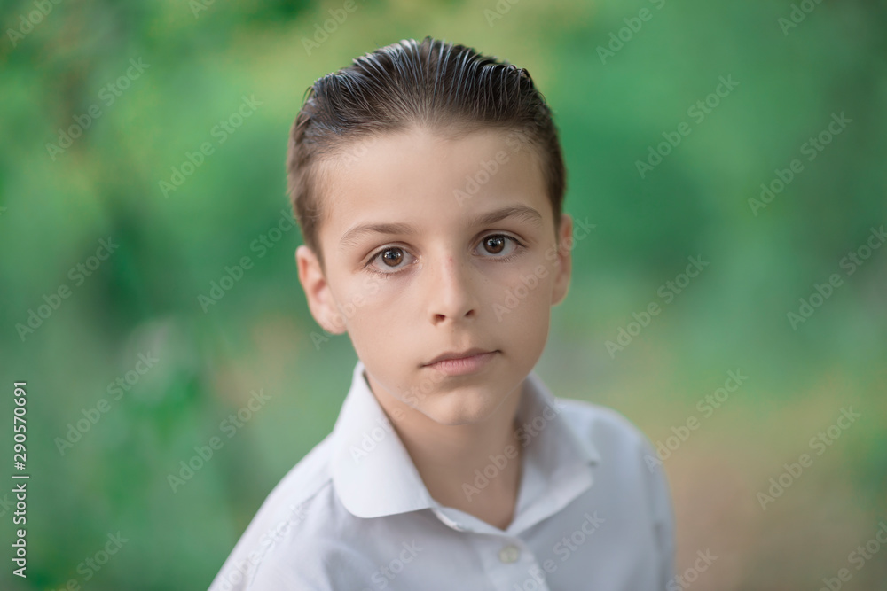 portrait of a adorable boy looking straight at the camera portrait of a adorable boy looking straight at the camera