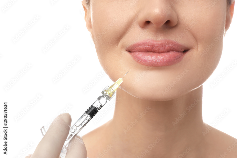Beautiful woman getting facial injection on white background, closeup. Cosmetic surgery Beautiful woman getting facial injection on white background, closeup. Cosmetic surgery