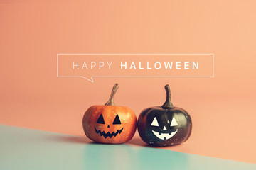Happy Halloween message, Pumpkin on pastel paper background.