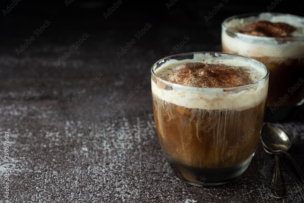 Affogato coffee with ice cream on a glass cup, dark, black background. Copy space. Affogato coffee with ice cream on a glass cup, dark, black background. Copy space.