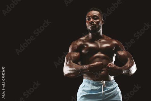 Attractive african bodybuilder showing his athletic body