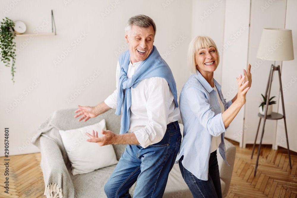 Obraz premium Senior couple dancing active dance at home