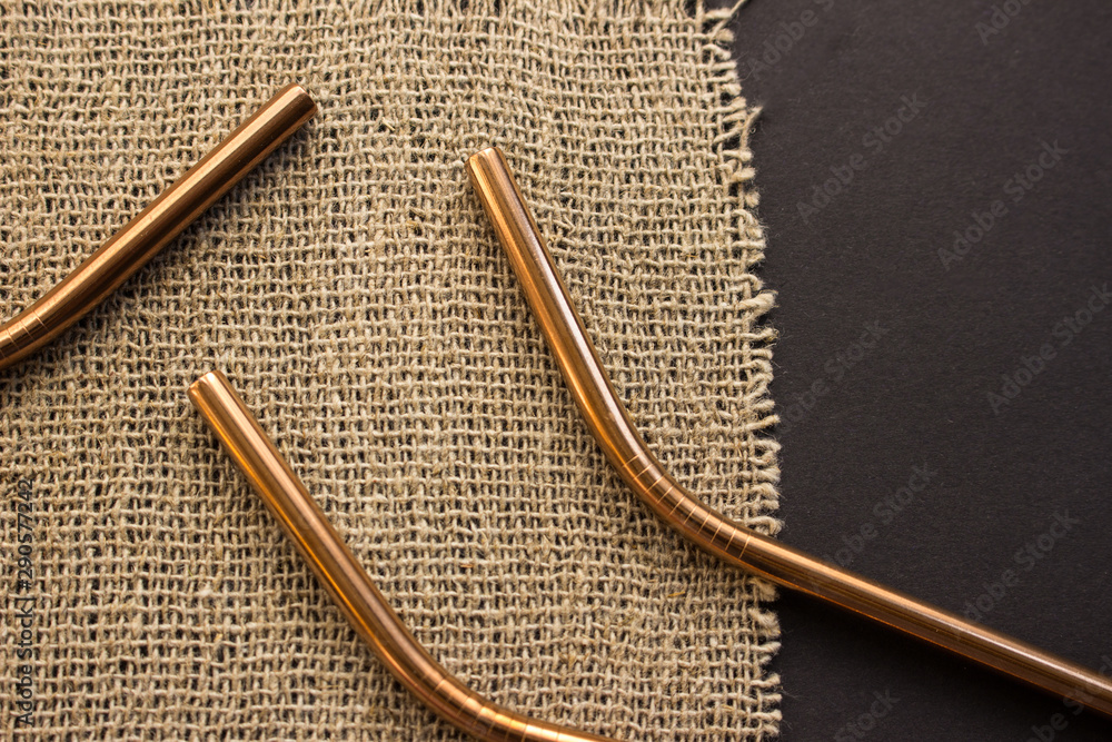 Metal straws on black background. Zero waste. Flat lay Metal straws on black background. Zero waste. Flat lay