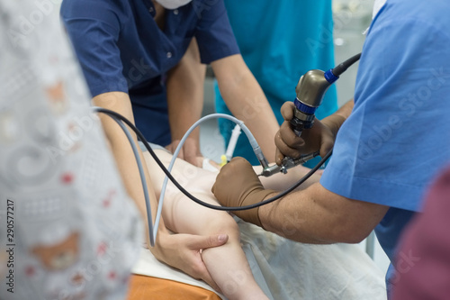 Εκτύπωση καμβά A team of urologist doctors performing a cystoscopy using a cystoscope