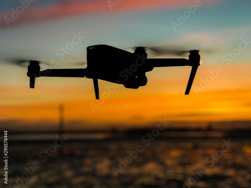 Drone in flying during sunset