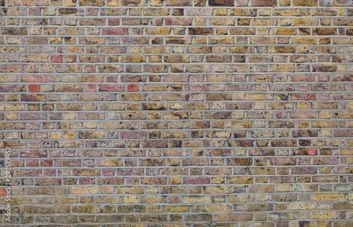 Panoramic View of Empty Old Urban Brick Wall Background With Copy Space. Creative Vintage Multicolored Texture Template. London Retro Style Building.