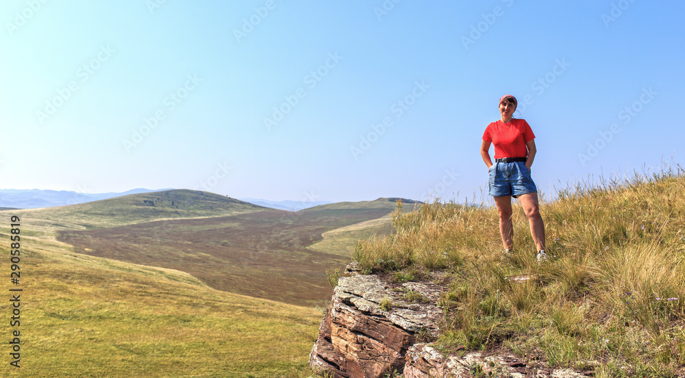 Woman hiker on the top of mountain Woman hiker on the top of mountain