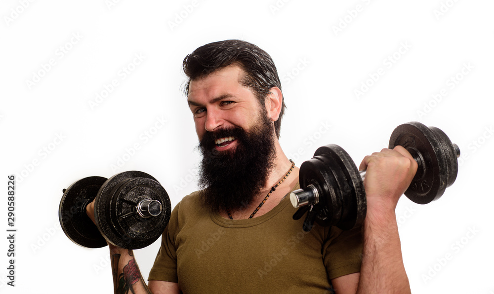 Happy man with dumbbells. Bearded man with dumbbells during an exercise. Muscular fitness man making weightlifting. Strong handsome sportsman working out with dumbbells. Man raising dumbbells. Happy man with dumbbells. Bearded man with dumbbells during an exercise. Muscular fitness man making weightlifting. Strong handsome sportsman working out with dumbbells. Man raising dumbbells.