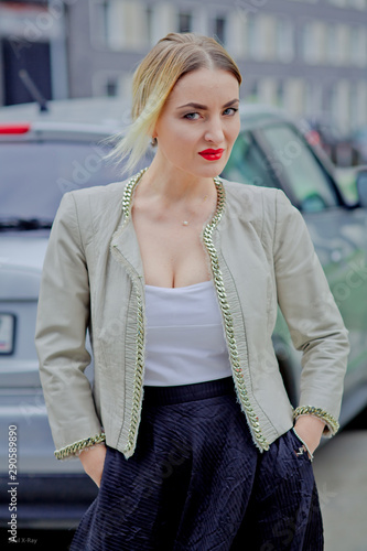 Stylish fashion portrait of blonde woman. Posing in the city © Margarita SoulRay