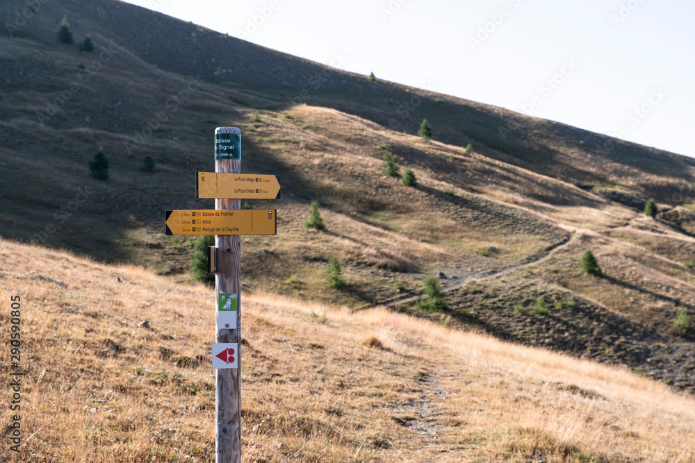 direction signs on hiking trails with place names noted on them, as well as the distance from these places direction signs on hiking trails with place names noted on them, as well as the distance from these places
