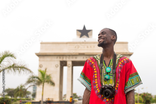 Man visiting the independence arch in Accra, Ghana