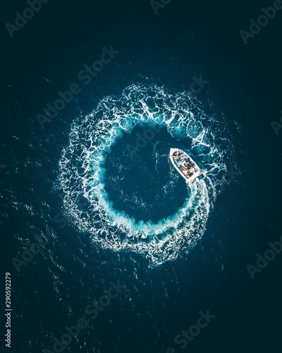 Aerial view of boat moving in sea