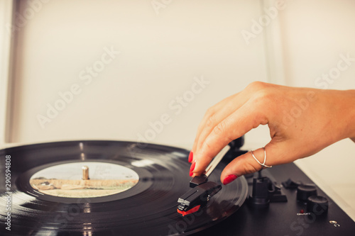 girl playing music on vinyl turntables